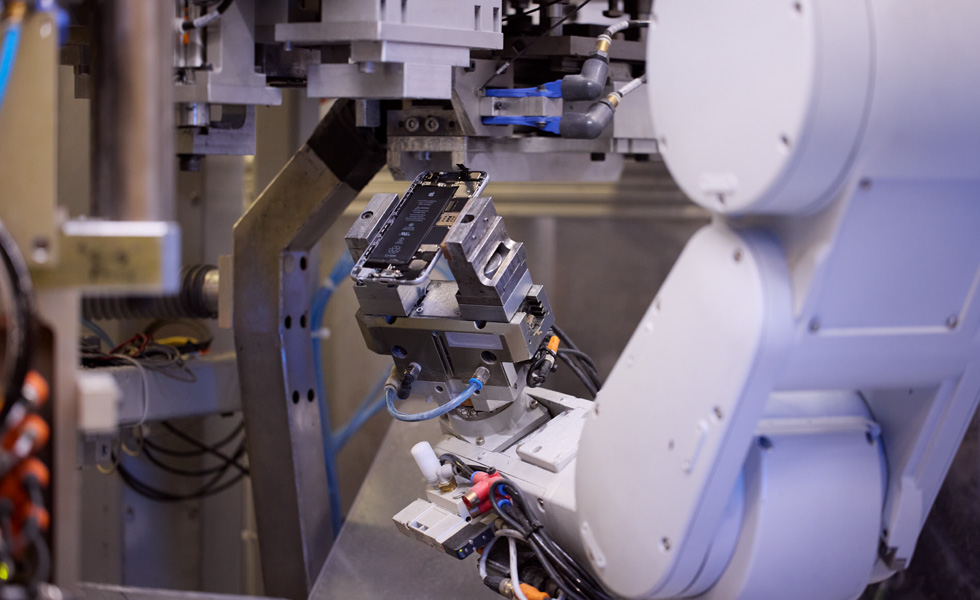 Disassembly robot, Daisy, holding parts of an iPhone